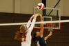 Anna Sims tips the ball against a Lyon College defender.  - Photo by Anne Richoux