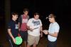 Stephen Clement, James Clary, and Beau Rinker receive a clue from Justin Boggs during the 7th annual Residence Life Treasure Hunt. - Photo by Zac Calvert