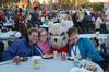 Melody Kramer, freshman nursing major, and her family have fun with Buster the bulldog during the Make-a-wish cookout for Family Weekend.   - Photo by Zac Calvert