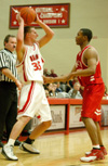 Sophomore guard Matt Trammell (35) looks over the Martin Methodist defense. - Photo by Courtney Ross