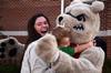 Mindy Winters, sophomore psychology major hugs Buster the bulldog during the Make-a-wish cookout for Family Weekend.  - Photo by Zac Calvert