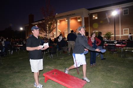 Michael Adkisson, freshman business management, and Michael's father play Cornhole outside of the Bowld Student Commons during the Make-a-wish cookout for Family Weekend. 