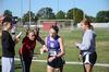 Cross country runners Audrey Hazlehurst, Lilli Harmon, and Whitney Sweet help high school runners in a race at Union.  - Photo by Zac Calvert