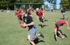 Dylan Baker, junior engineering major, runs down the field during a game of flag football on Family Weekend. - Photo by Jacob Moore