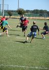 Bryan Meeker, sophomore business administration major, runs down the field during a game of flag football on Family Weekend. - Photo by Jacob Moore