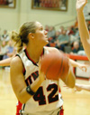 Senior forward Ginger Bryant turns to shoot over a Martin Methodist defender. - Photo by Steven Aldridge