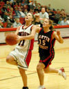 Sophomore guard Jennifer Henson (11) outruns a Martin Methodist defender for an easy lay-up in Union's TranSouth Conference win. - Photo by Steven Aldridge