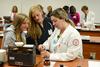 Pharmacy student Jennifer Felder explains a demonstration to prospective students visiting the School of Pharmacy. - Photo by Jacob Moore