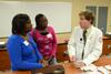 Pharmacy student Brad Spencer talks with prospective students during  a demonstration in Providence Hall. - Photo by Jacob Moore