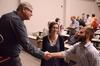 Dr. Graham Cole, Anglican Professor of Divinity at Beeson Divinity School, greets and discusses religion and philosophy with Abigail Ebensburger, junior philosophy major, and Chase Techentin, senior music major. - Photo by Zac Calvert