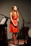Whitney Williams, senior English major, sings at Open Mic in Barefoots Joe. - Photo by Zac Calvert