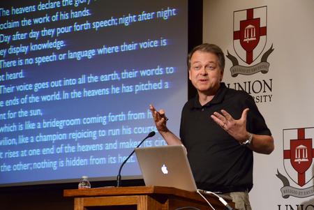 Jeffrey Hardin, professor and chair of the department of zoology at University of Wisconsin-Madison, speaks on "Glory in Fascination" to members of the Pew Research program.