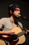 Rob Griffith, sophomore English major, performs with the band Flying Colours in Barefoots Joe.  - Photo by Anne Richoux