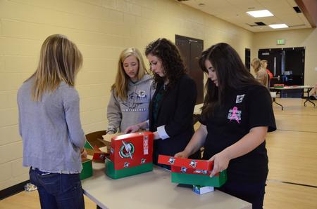 Students help pack Operation Christmas Child boxes during Campus and Community Day. 