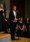 Chris Matthews, associate professor of music and department chair, introduces a song during the annual Fall Choral Concert. - Photo by Jacob Moore