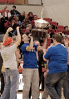 The men of Alpha Tau Omega celebrate their Homecoming Cup 2004 victory. - Photo by Lindsay Stavish