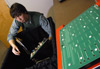 Freshman Andy Robinette, engineering major, works on a light board designed to help children with Cortical Visual Impairment disease, which causes blindness. When completed, his invention will be used at the Star Center in Jackson. - Photo by Jim Veneman