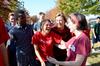 Josselyne Bustillo (center), freshman political science major, celebrates a win with her teammates during Homecoming Olympics. - Photo by Jacob Moore