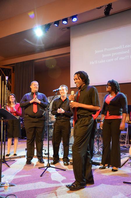 Derique Cannon (front), junior electrical engineering major, leads MOSAIC choir during chapel.