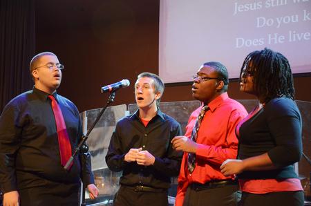 MOSAIC choir members Cedric Townsend, Zac McMillan, David Madden, and Treasure Hightower lead music during chapel.
