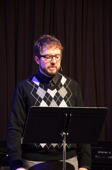 Taylor Worley, associate dean for spiritual life, reads scripture during chapel.
