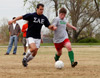 Jonathan Harris and Brandon Nelms battle for position during the men's intramural soccer championship between SAE 1 and Onions 1. - Photo by Kristen Nicole Sayres