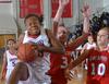 Despite heavy pressure from Saint Xavier Union's Lavanda Ross was able to score points at will. - Photo by Morris Abernathy