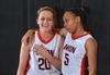 Amy Philamlee and LeTesa McLaughlin share a fun moment in the waning moments of their game with Saint Xavier University. - Photo by Morris Abernathy