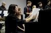 Pianists Brandon Swing, sophomore music major, and Anna Lewis, sophomore TESL major, prepare their sheet music during the Fall 2011 Jazz Band Concert. - Photo by Jacob Moore