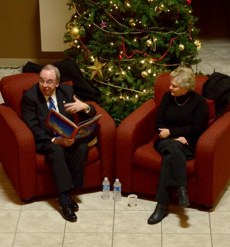 David S. Dockery, president of the university, reads the Christmas story to a group of students. This is an annual event that takes place in the McAfee Commons.