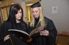 Fellow Psychology majors Catherine Hamilton and Brittany Dement look to make sure they are in the correct order in line  just before the Commencement Service.  - Photo by Morris Abernathy