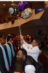 Family and friends cheer for graduates during the 2011 Fall Commencement Services. - Photo by Jacob Moore