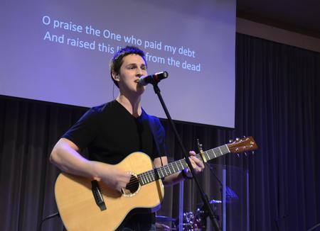 Brett Perkins, senior Christian studies major, leads chapel music.