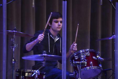 Joey Davis, sophomore business marketing major, plays drums during the music portion of chapel.