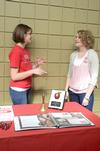 Emily Grove, sophomore special education major, and Rachel Emanuel, sophomore TESL/Spanish major, talk at the Student Tennessee Education Association table during the student organization fair.  - Photo by Anne Richoux