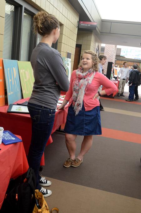 Hannah Mahoney and Rachel Skaret, junior nursing majors, chat during the student organization fair in the Student Union Building. 