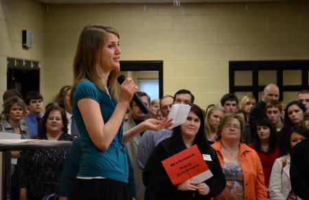 Ruth Bone, 2011 Scholars of Excellence participant, welcomes prospective students to Scholars of Excellence Weekend during registration.