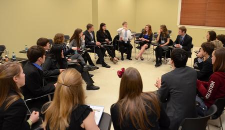 Scholars of Excellence participants play a game of Catchphrase during a break between interviews.