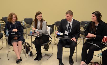 Scholars of Excellence participants play a game of Catchphrase during a break between interviews.