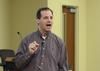 Sean Evans, associate professor and chair of the department of political science, speaks at the Town & Gown lecture series. - Photo by Jacob Moore