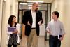 Josselyne Bustillo, freshman political science major, Micah Watson, assistant professor of political science, and Luke Trammel, sophomore political science major, chat in the hallway. - Photo by Kristi McMurry