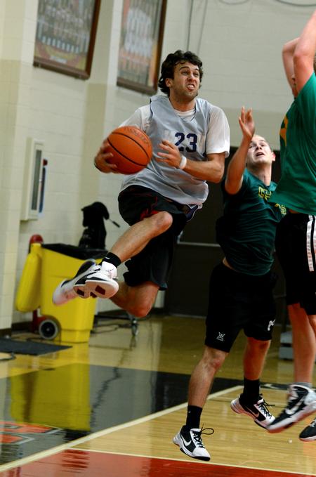 Chase Tuggle, senior youth ministry major, goes up for a shot against Lamda Chi players during an intramural basketball game.