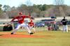 Colin Hatch pitches to a Taylor University player during a double-header. The Bulldogs won both games on Saturday.  - Photo by Anne Richoux
