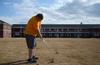 Grant Wilson, freshman business administration major, hits a golf ball in the Watters Quad on a nice day. - Photo by Zac Calvert