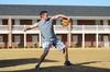 David Virgin, sophomore accounting major, throws a baseball around with friends on a clear day outside the Ayers Residence Complex. - Photo by Zac Calvert