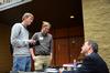 Michael Lewis, senior biology major, and Austin Gray, junior English major, talk to James Scruton, poet and head of the humanities division at Bethel College, after Scruton's poetry reading. - Photo by Zac Calvert