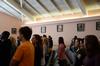 Students attend chapel surrounded by donated paintings of the gospel story. - Photo by Ebbie Davis