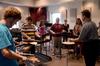 Michael Mann (right), visiting assistant professor of music, conducts a percussion class in Jennings Hall.  - Photo by Ebbie Davis
