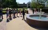 Lindsey Howerton, sophomore DMS major, describes her 3D art project to Union students by the fountain. - Photo by Zac Calvert