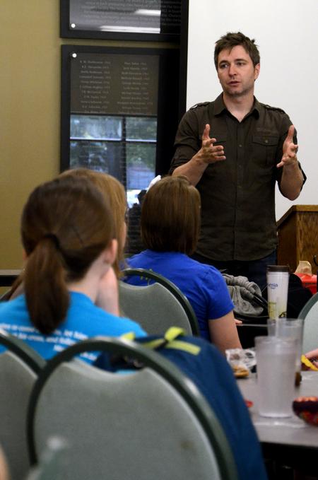 Travis Cottrell talks to students about his duties as worship pastor at Englewood Baptist Church during a CCMS event. 